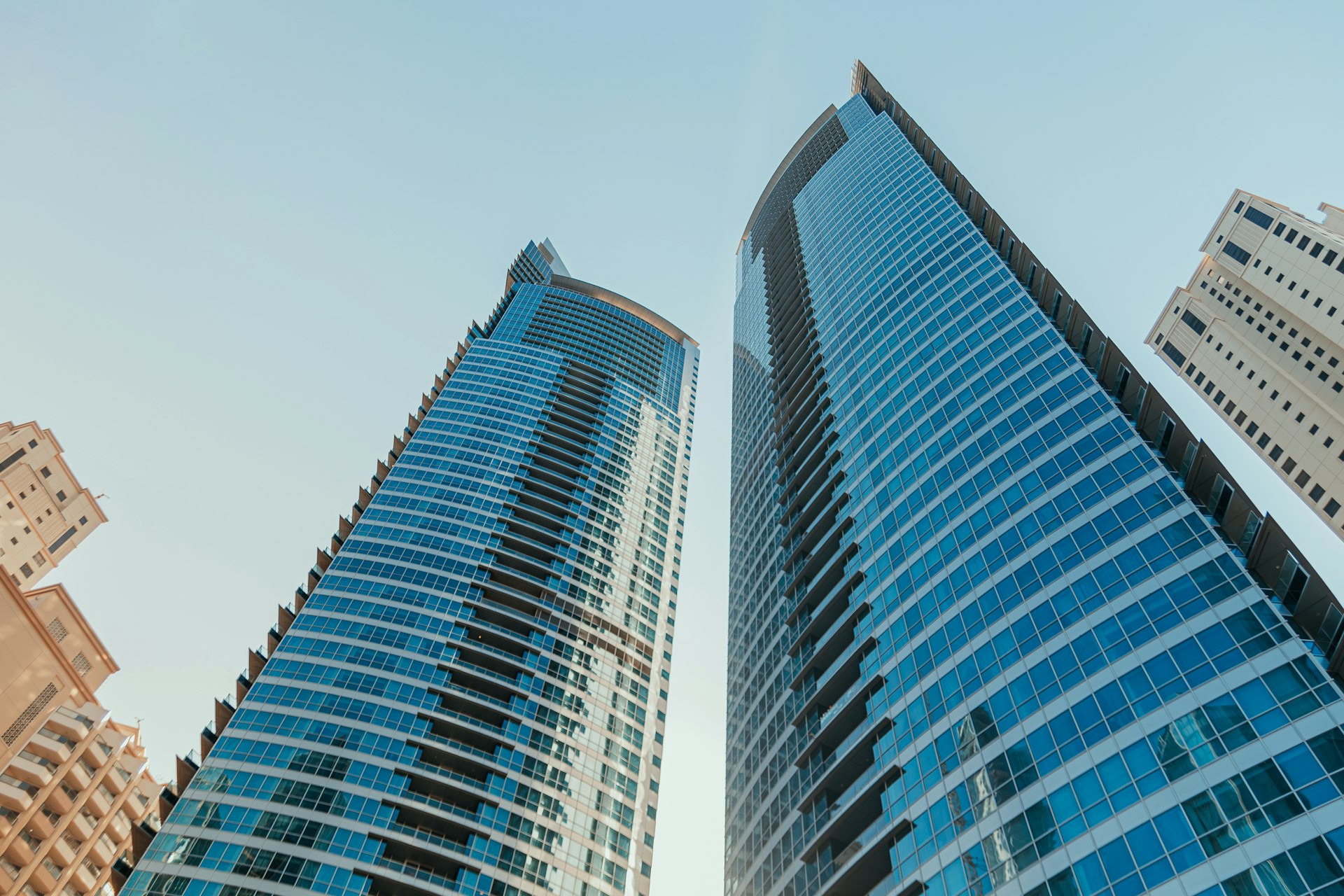A couple of tall buildings sitting next to each other